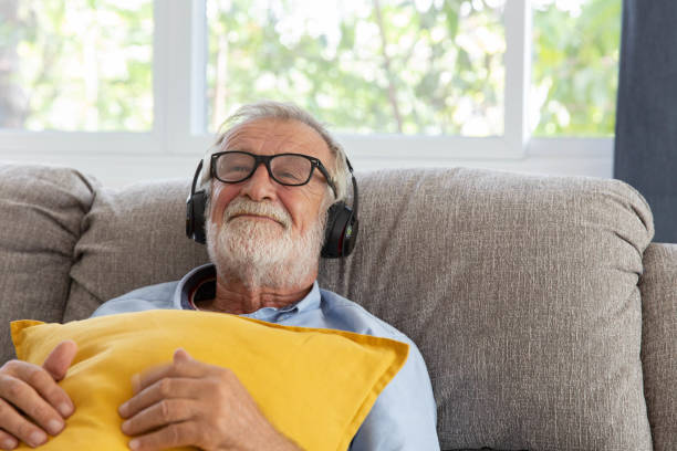 Senior adult experiencing deep relaxation and crystal clear focus while listening to sound frequency system